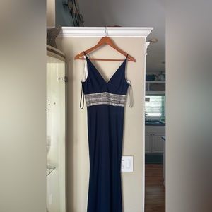 Brand new, navy blue with silver embellished jeweled waistband evening gown.